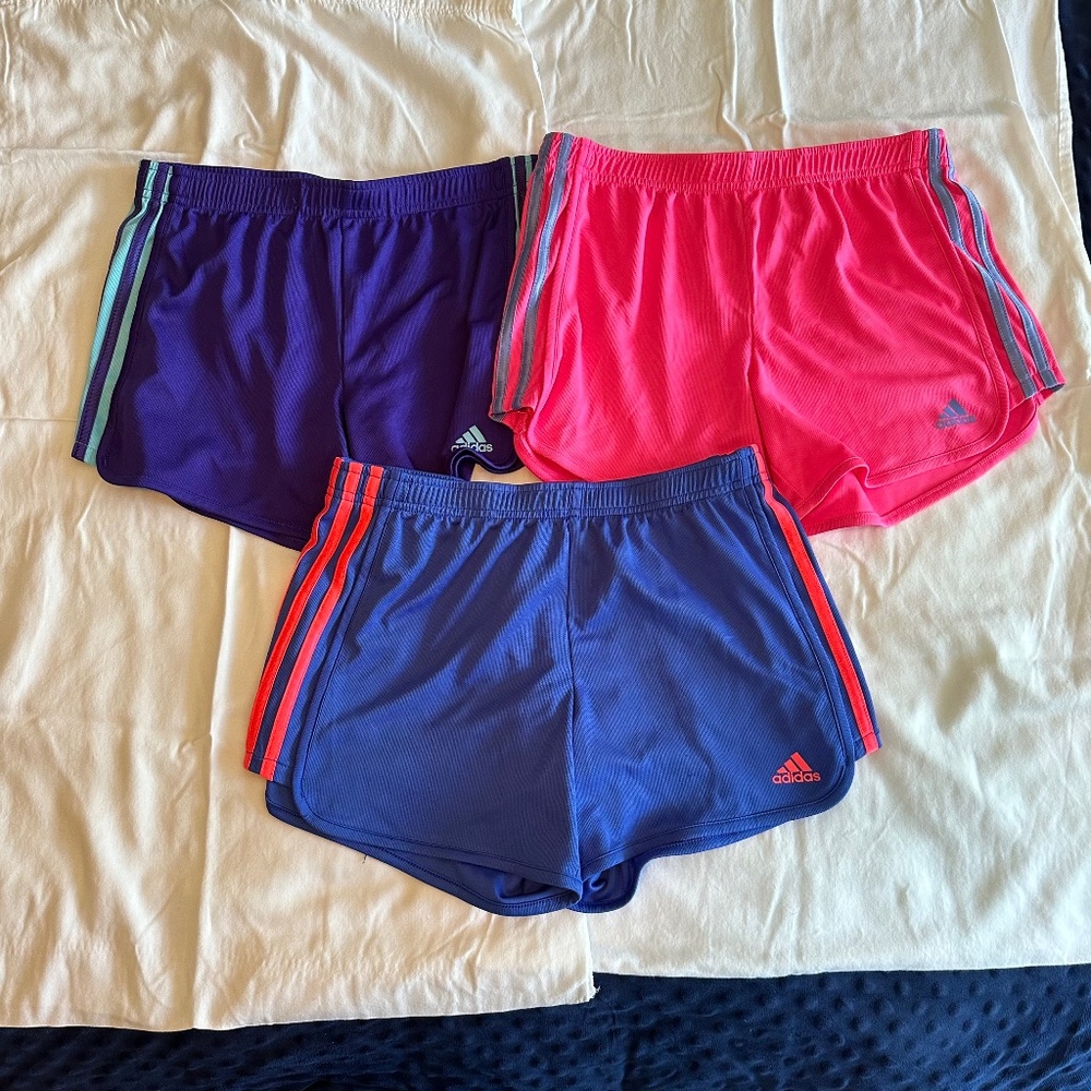 Adidas Girl‘s short bundle.  Size XL(14/16).  Excellent used. Blue, pink, purple